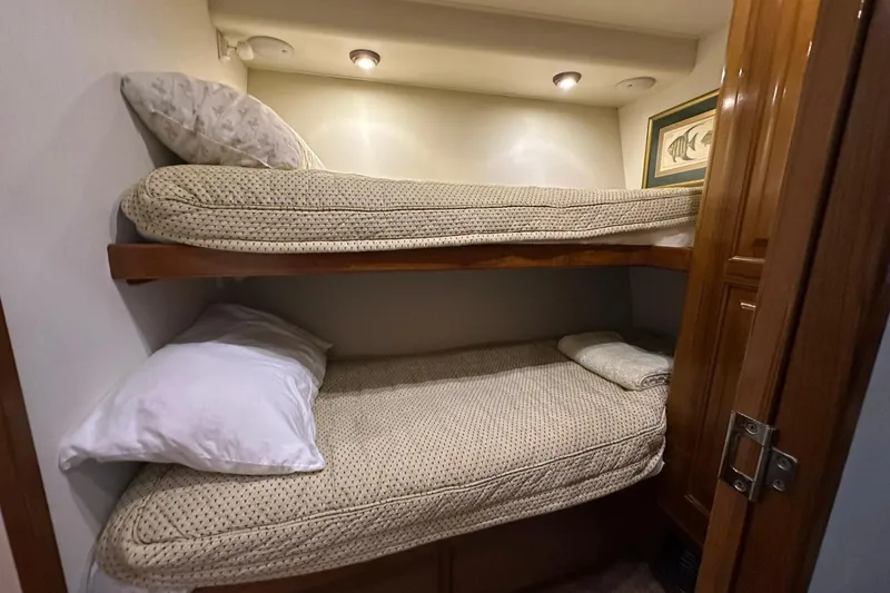 Slide: The Image of Bunk beds in 1998 Viking 54 Motor Yacht cabin, cozy and well-lit interior. - 38