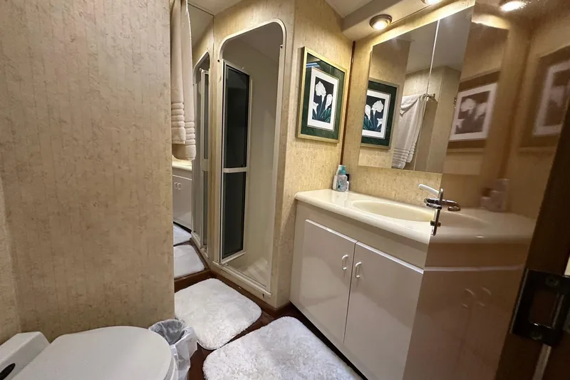 Slide: The Image of Luxurious bathroom in 1998 Viking 54 Motor Yacht with shower, vanity, and elegant decor. - 39
