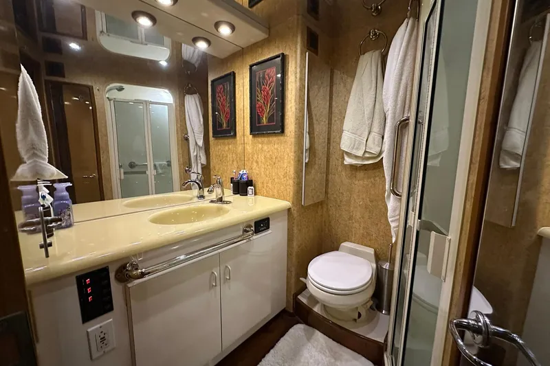 Slide: The Image of Luxurious bathroom in 1998 Viking 54 Motor Yacht with elegant fixtures and decor. - 45