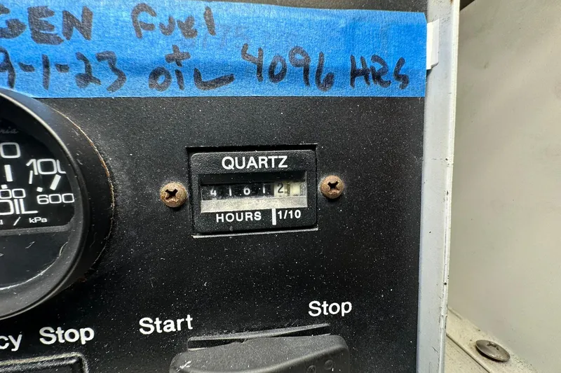 Slide: The Image of Hour meter on 1998 Viking 54 Motor Yacht dashboard, showing 4106.4 hours. - 48