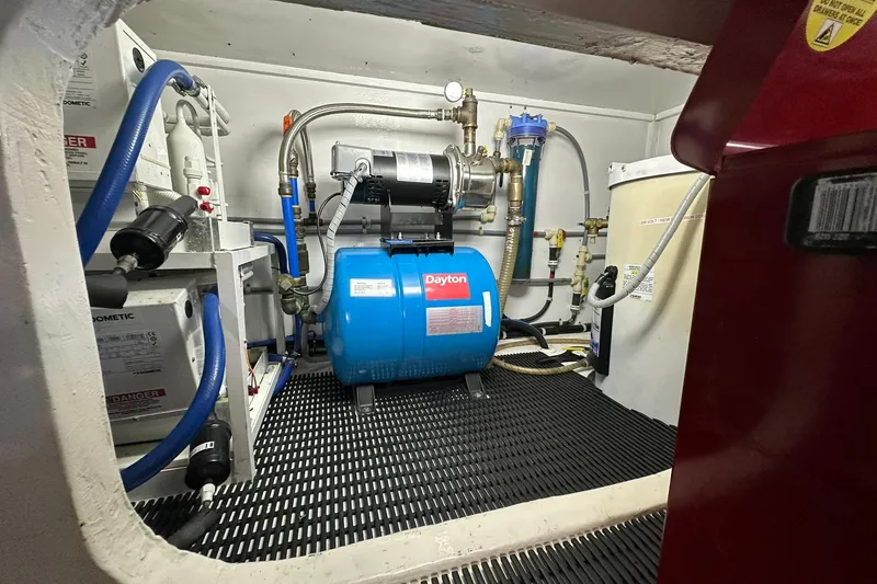 Slide: The Image of Engine room of 1998 Viking 54 Motor Yacht with Dayton equipment and plumbing. - 51