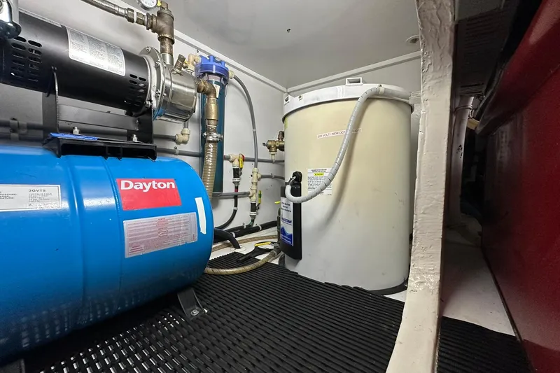 Slide: The Image of Engine room of 1998 Viking 54 Motor Yacht with Dayton equipment and water tank. - 52