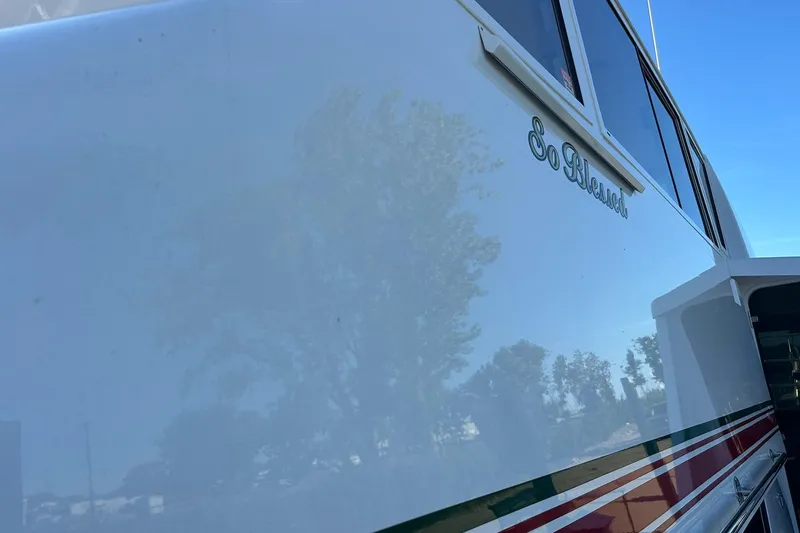 Slide: The Image of Side view of a 1998 Viking 54 Motor Yacht with "So Blessed" inscription. - 6