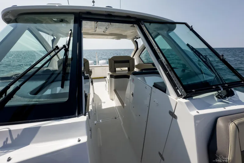 Slide: The Image of 2021 Pursuit DC 326 Dual Console boat interior with ocean view. - 13