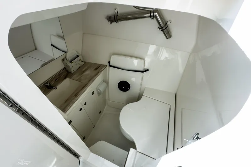 Slide: The Image of 2021 Pursuit DC 326 Dual Console boat interior with modern bathroom amenities. - 14