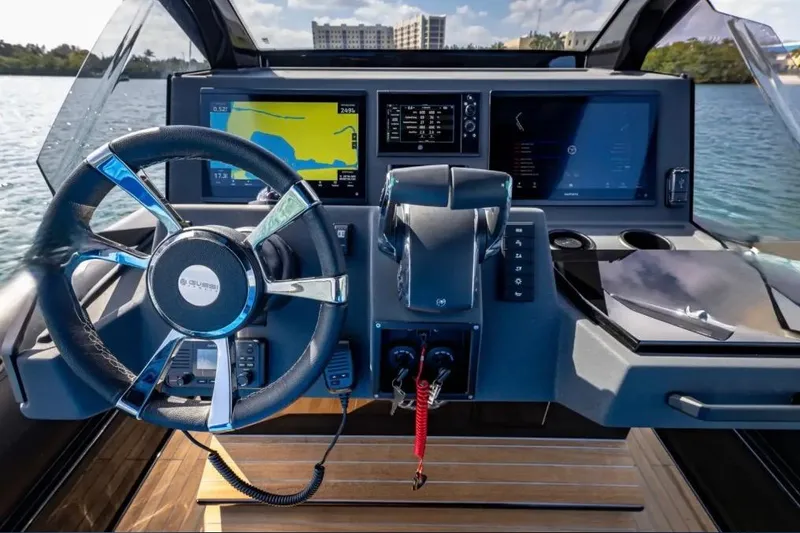 Slide: The Image of 2025 Technohull 38 Gran dashboard with modern navigation screens and steering wheel. - 21