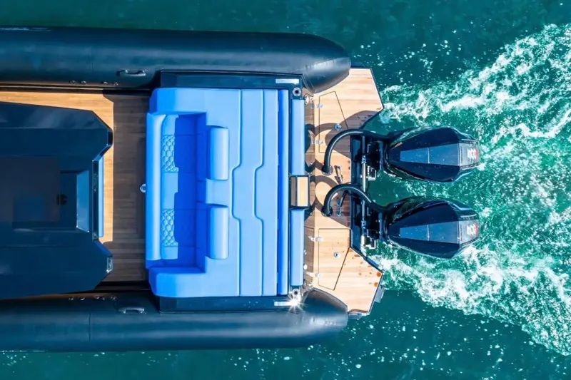 Slide: The Image of Aerial view of 2025 Technohull 38 Gran boat with twin engines and blue seating. - 4