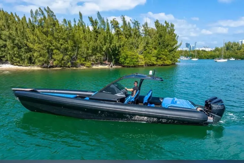 Slide: The Image of 2025 Technohull 38 Gran boat cruising on a scenic, green waterway. - 8