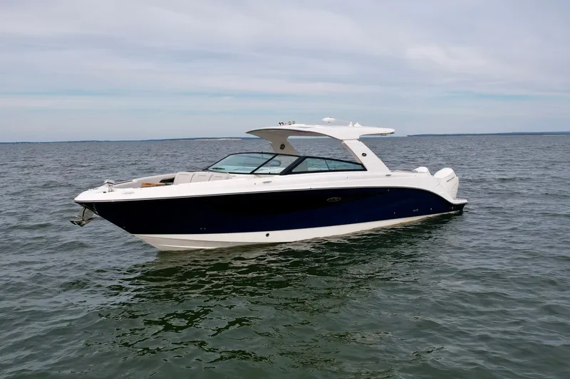 The Image of 2025 Sea Ray SLX 400 Outboard boat on open water, showcasing sleek design and luxury features. - 0