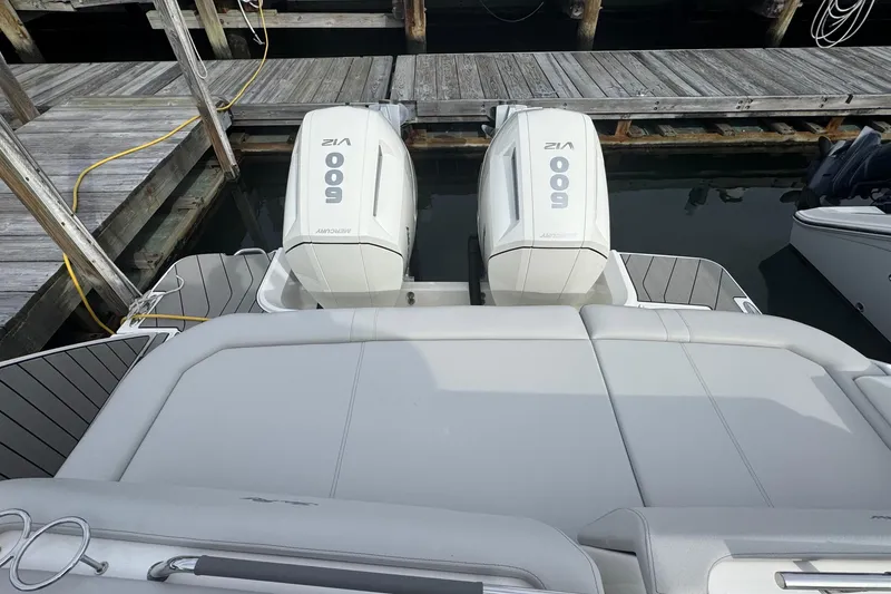 Slide: The Image of 2025 Sea Ray SLX 400 Outboard with twin Mercury 600 engines at dock. - 14
