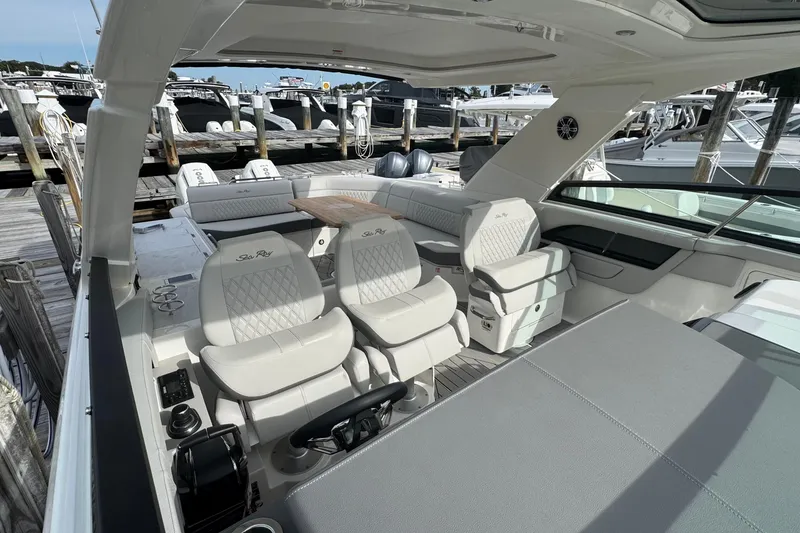 Slide: The Image of Luxurious 2025 Sea Ray SLX 400 Outboard boat interior with plush seating and sleek design. - 27