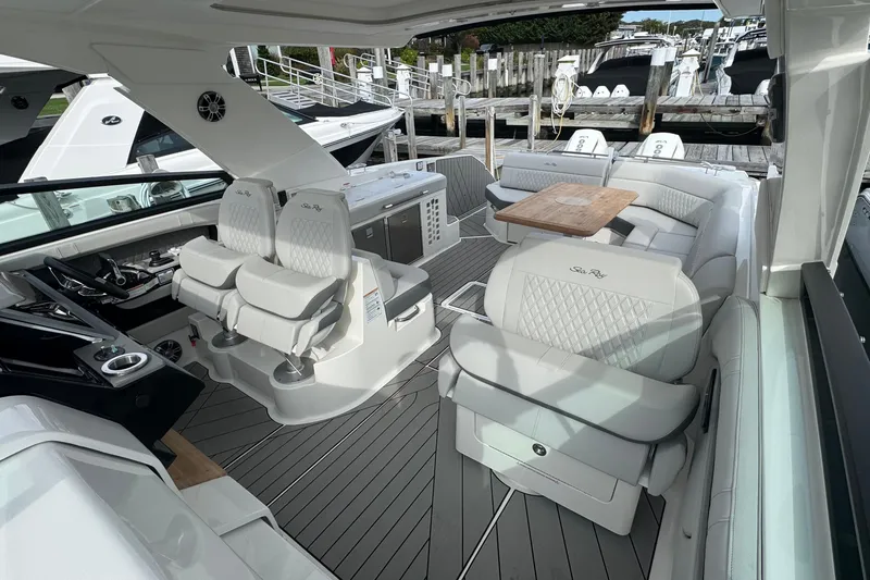 Slide: The Image of Luxurious 2025 Sea Ray SLX 400 Outboard boat interior with elegant seating and modern amenities. - 28