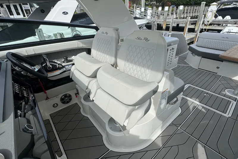 Slide: The Image of 2025 Sea Ray SLX 400 Outboard cockpit with luxurious seating and modern controls. - 29