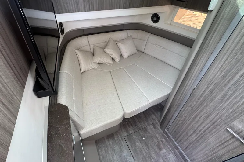 Slide: The Image of Luxurious interior of 2025 Sea Ray SLX 400 Outboard with plush seating and modern design. - 36