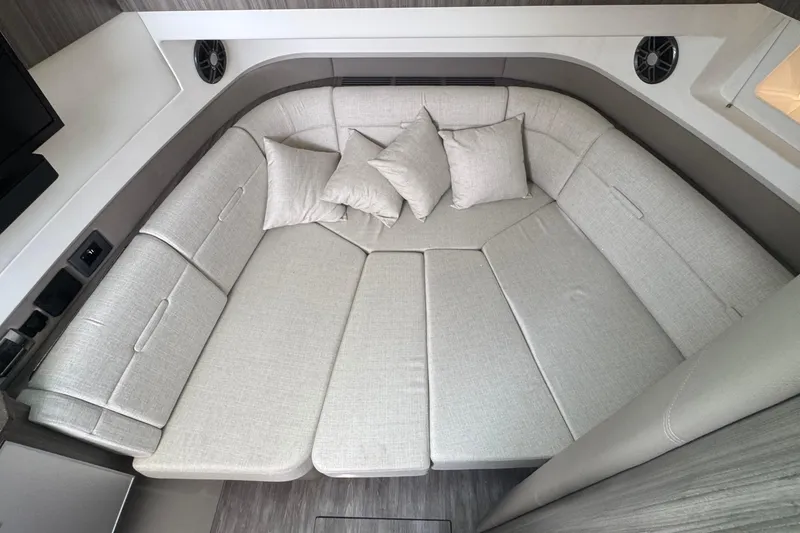 Slide: The Image of Luxurious interior seating of 2025 Sea Ray SLX 400 Outboard with plush cushions. - 37