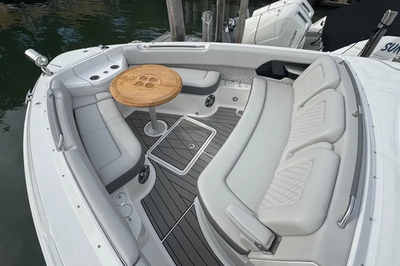 Slide: The Image of Luxurious 2025 Sea Ray SLX 400 Outboard boat interior with elegant seating and wooden table. - 45
