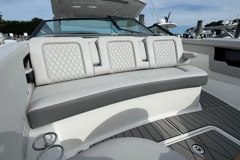 Slide: The Image of Luxurious seating on 2025 Sea Ray SLX 400 Outboard boat, featuring elegant diamond-pattern upholstery. - 51