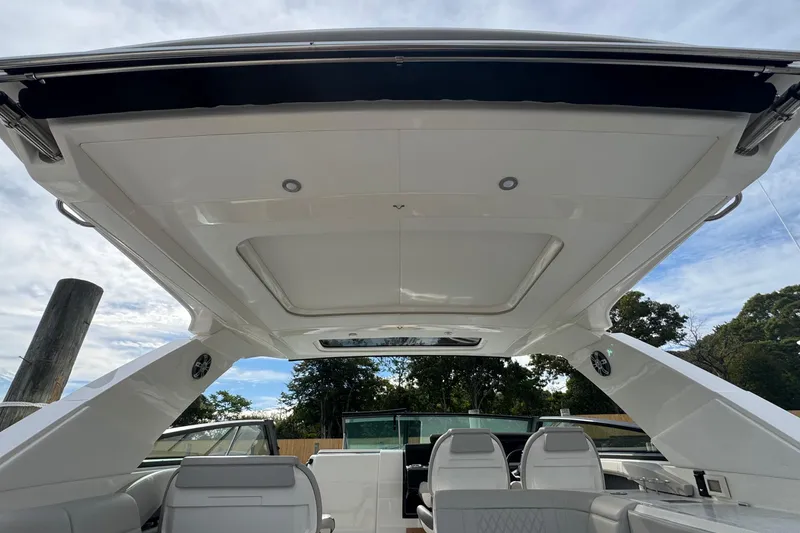 Slide: The Image of 2025 Sea Ray SLX 400 Outboard interior with sleek design and modern seating. - 52