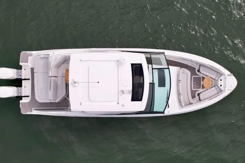 Slide: The Image of Top view of 2025 Sea Ray SLX 400 Outboard luxury boat on water. - 6