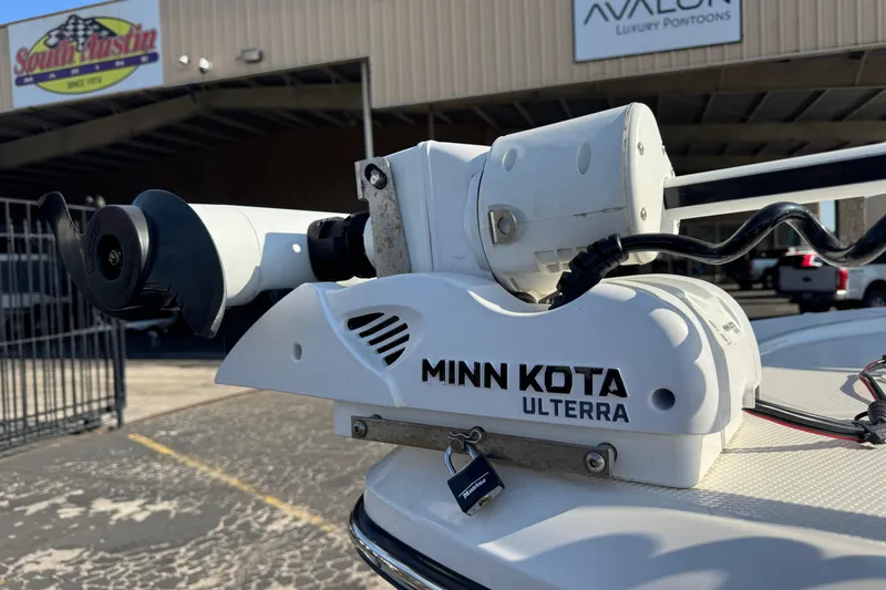 Slide: The Image of Minn Kota Ulterra motor on 2023 Robalo 206 Cayman boat at dealership. - 10