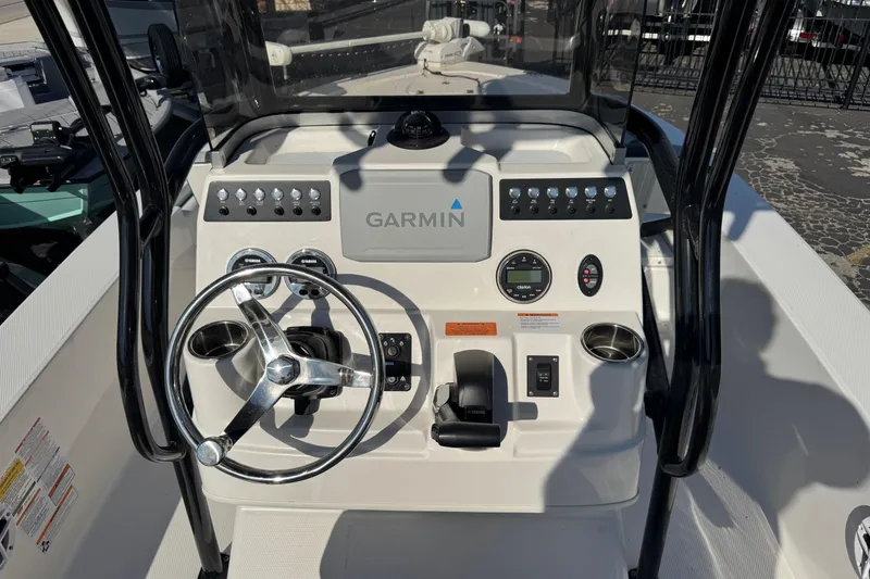 Slide: The Image of 2023 Robalo 206 Cayman boat dashboard with Garmin navigation system. - 12