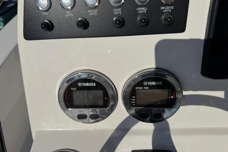 Slide: The Image of Control panel of 2023 Robalo 206 Cayman boat with Yamaha gauges and switches. - 14