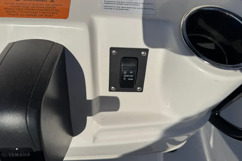 Slide: The Image of 2023 Robalo 206 Cayman boat dashboard with jackplate control switch. - 16