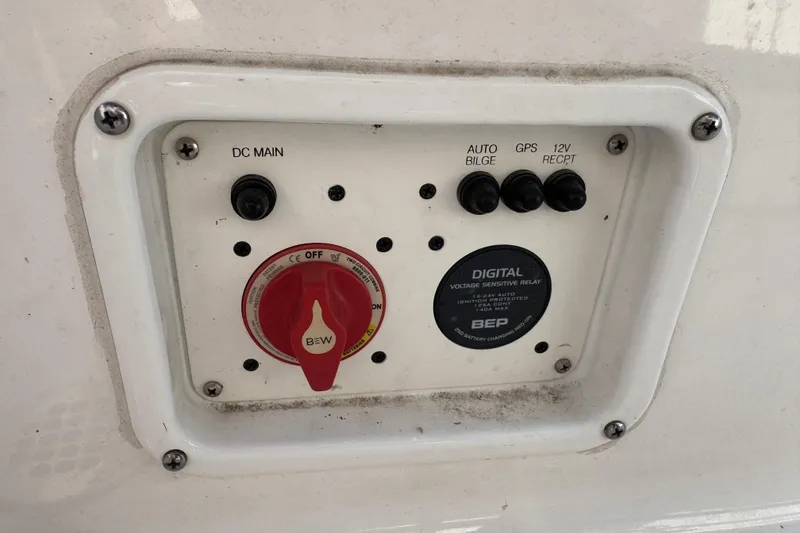 Slide: The Image of Control panel on a 2023 Robalo 206 Cayman boat with switches and voltage relay. - 17