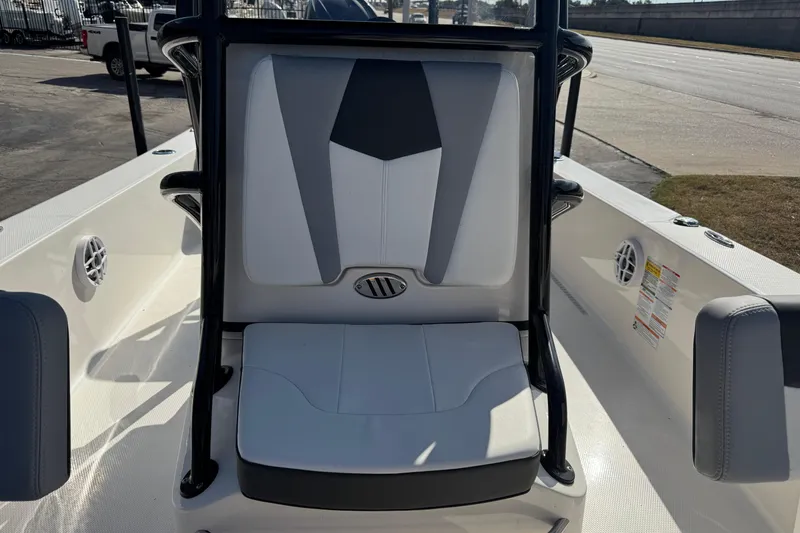 Slide: The Image of 2023 Robalo 206 Cayman boat interior seating with modern design and speaker system. - 19