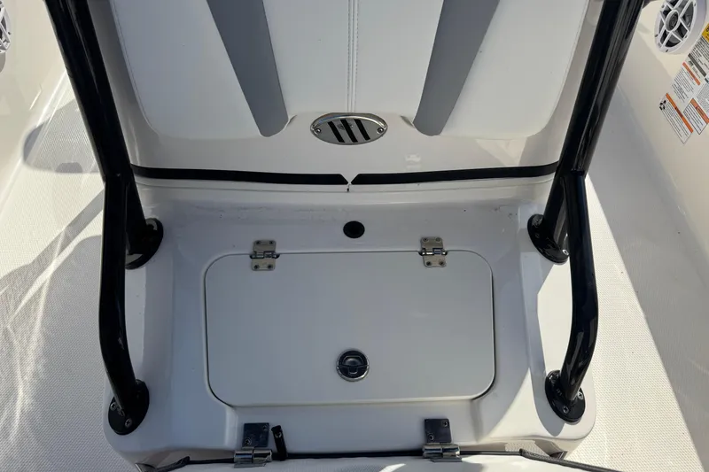 Slide: The Image of 2023 Robalo 206 Cayman boat interior with storage compartment and seating. - 20