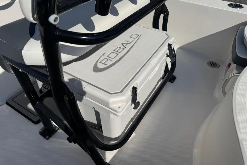 Slide: The Image of 2023 Robalo 206 Cayman boat interior with branded cooler and seating. - 25