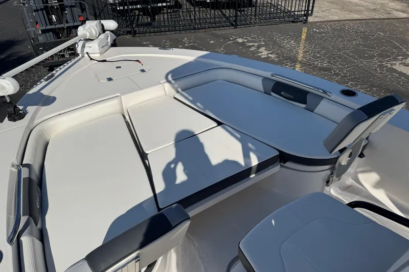 Slide: The Image of 2023 Robalo 206 Cayman boat interior with seating and trolling motor. - 26