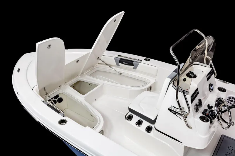 Slide: The Image of Manufacturer Provided Image: 2023 Robalo 206 Cayman boat interior with open storage compartments and control console. - 27