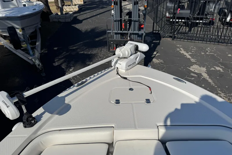 Slide: The Image of 2023 Robalo 206 Cayman boat with Minn Kota trolling motor on deck. - 28