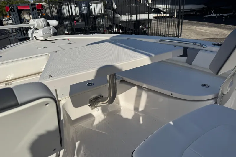 Slide: The Image of 2023 Robalo 206 Cayman boat interior with seating and storage compartments. - 36
