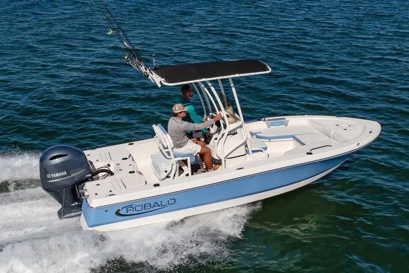 Slide: The Image of Manufacturer Provided Image: 2023 Robalo 206 Cayman boat cruising on the water with two people onboard. - 48