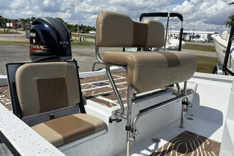 Slide: The Image of 2022 Xpress H22B Bay boat interior with seating and Yamaha 175 engine. - 10