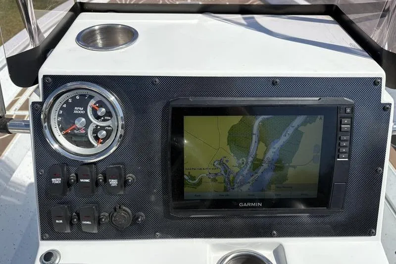 Slide: The Image of Dashboard of 2022 Xpress H22B Bay boat with Garmin GPS and RPM gauge. - 13