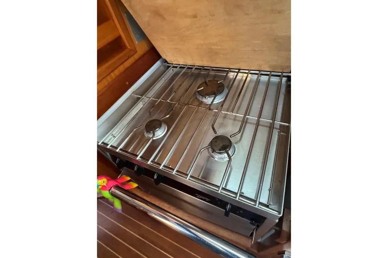 Slide: The Image of Three-burner stove in a 2005 Sabre 386 yacht kitchen. - 14