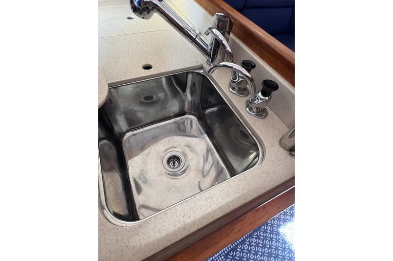 Slide: The Image of Stainless steel sink with faucet in 2005 Sabre 386 yacht kitchen. - 16