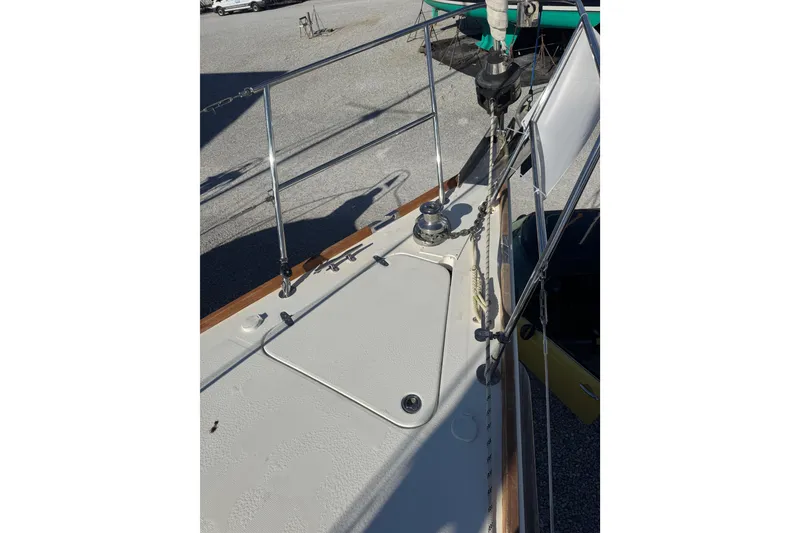 Slide: The Image of 2005 Sabre 386 sailboat deck with winch and railing details. - 3