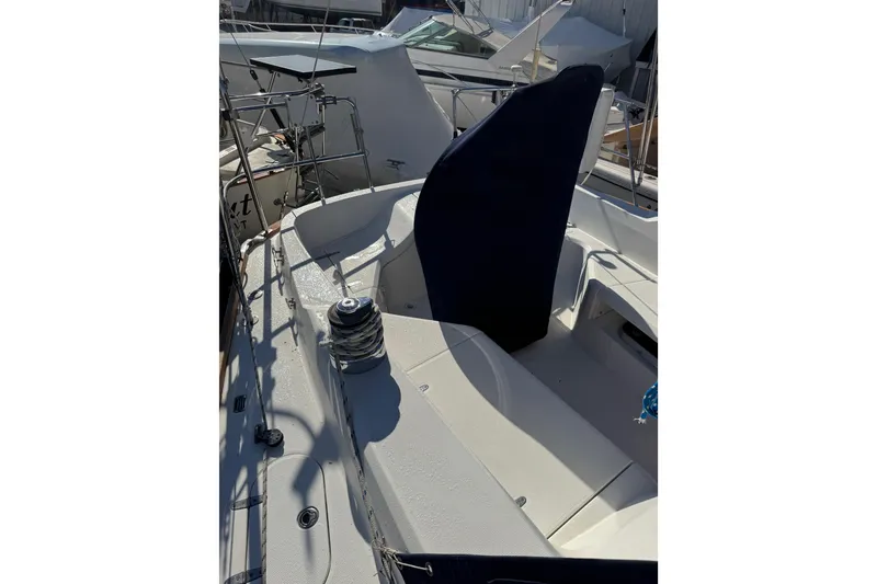 Slide: The Image of 2005 Sabre 386 sailboat deck with winch and seating area. - 31
