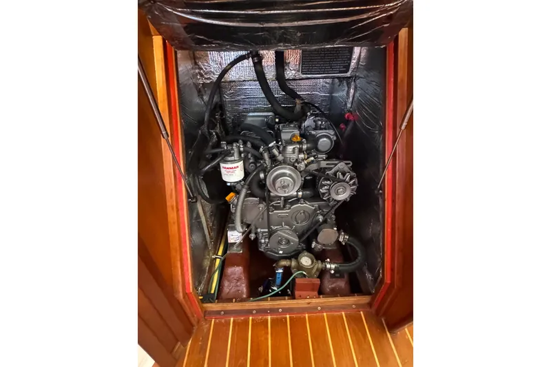 Slide: The Image of Engine compartment of a 2005 Sabre 386 sailboat, featuring a Yanmar engine. - 34