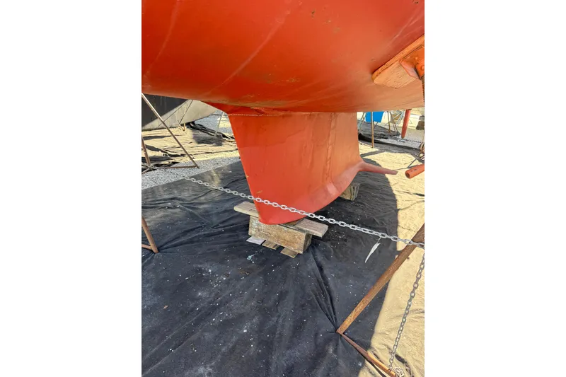 Slide: The Image of 2005 Sabre 386 sailboat keel in dry dock, supported by chains and blocks. - 41