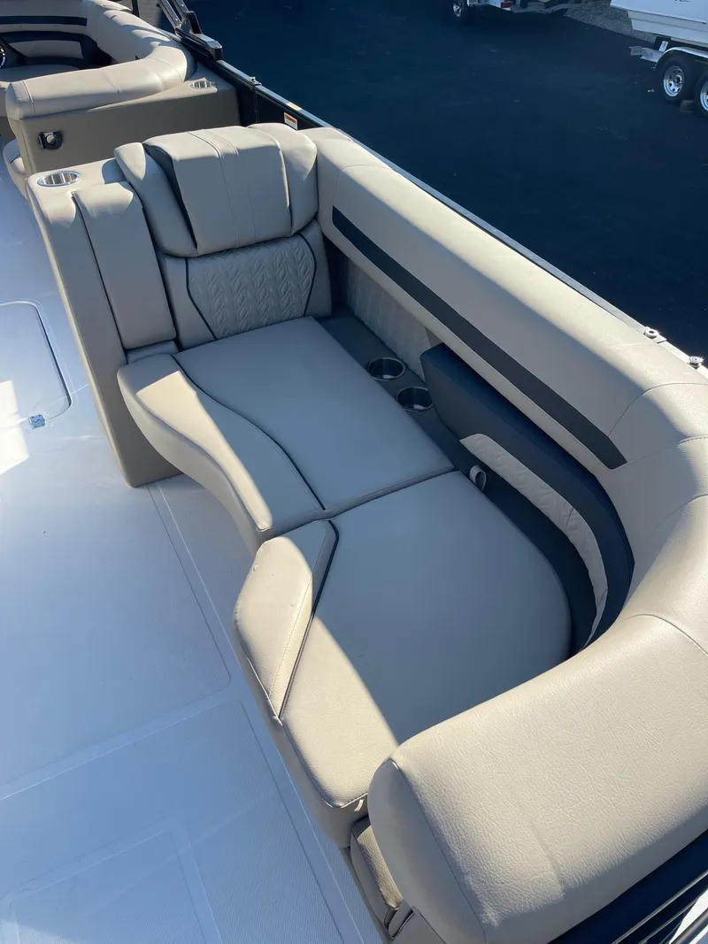 Slide: The Image of 2023 Hurricane FunDeck 2360 SBC boat seating, featuring luxurious gray upholstery and cup holders. - 10