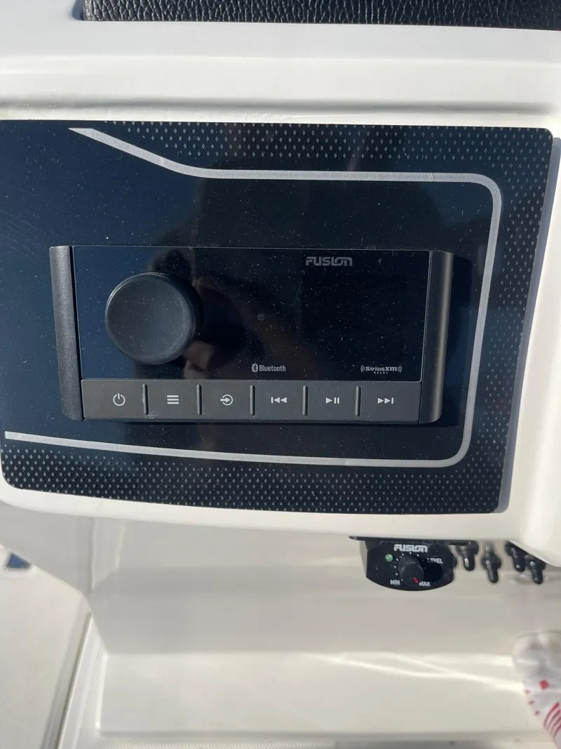 Slide: The Image of Fusion stereo system on 2023 Hurricane FunDeck 2360 SBC boat dashboard. - 25