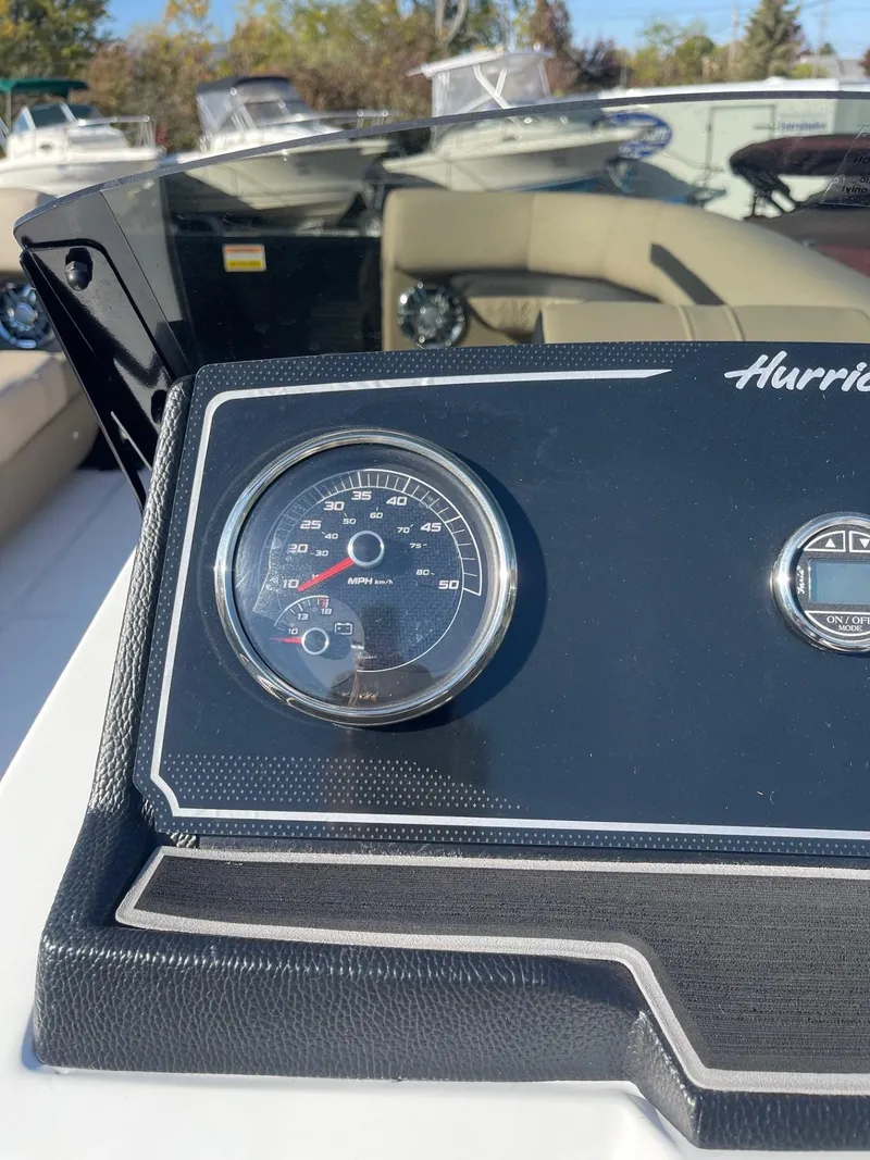 Slide: The Image of 2023 Hurricane FunDeck 2360 SBC dashboard with speedometer and steering wheel. - 26
