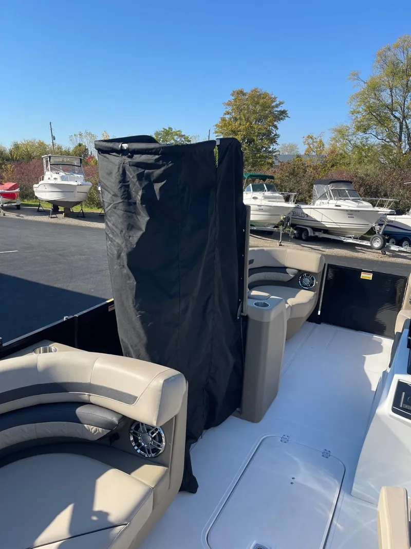 Slide: The Image of 2023 Hurricane FunDeck 2360 SBC boat interior with seating and covered console. - 41