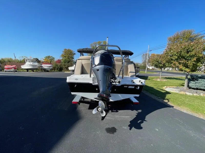 Slide: The Image of 2023 Hurricane FunDeck 2360 SBC boat with outboard motor on a sunny day. - 43