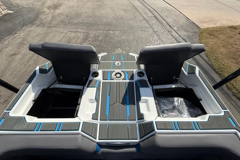 Slide: The Image of 2026 Supra SA 450 boat interior with open storage compartments and sleek design. - 19